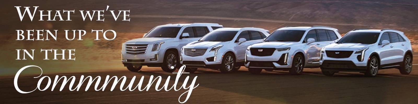 Community banner, with Cadillac vehicles on a desert terrain